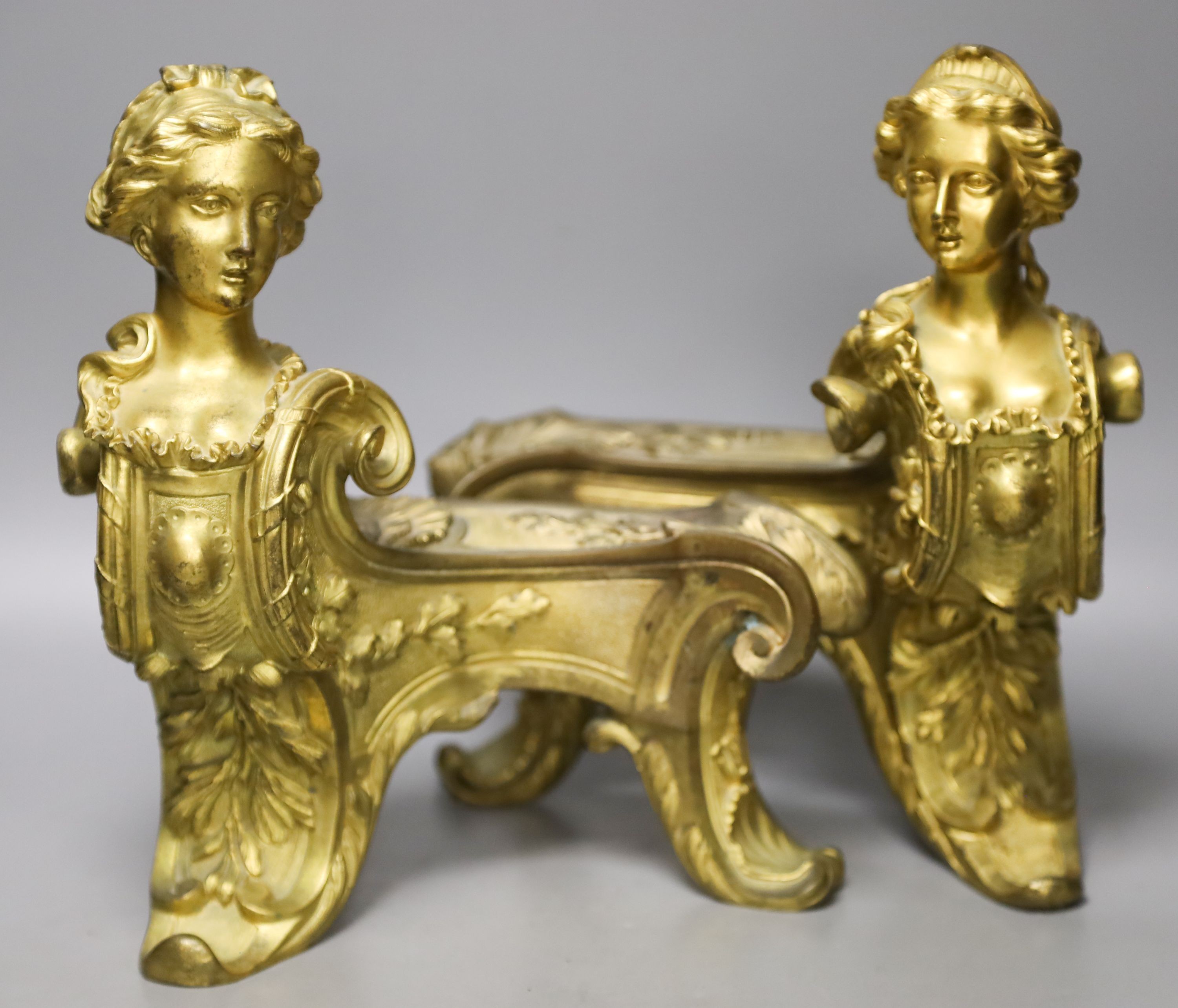 A pair of Louis XV style ormolu chenet 26cm